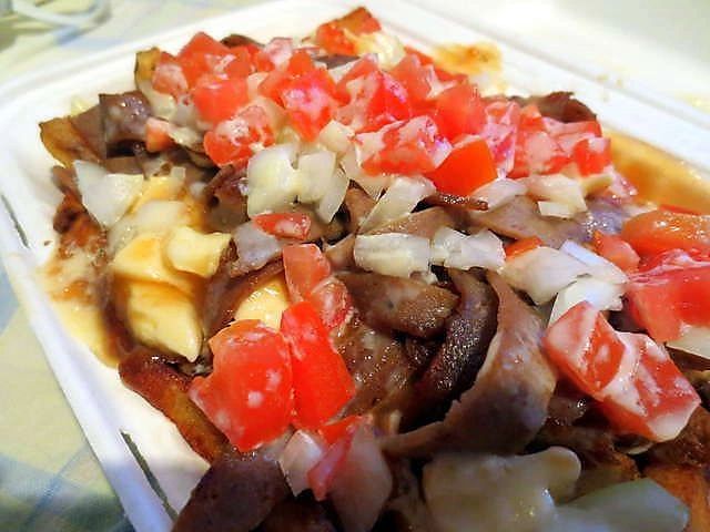 Dillo's donair poutine, loaded with donair meat, tomato and onion