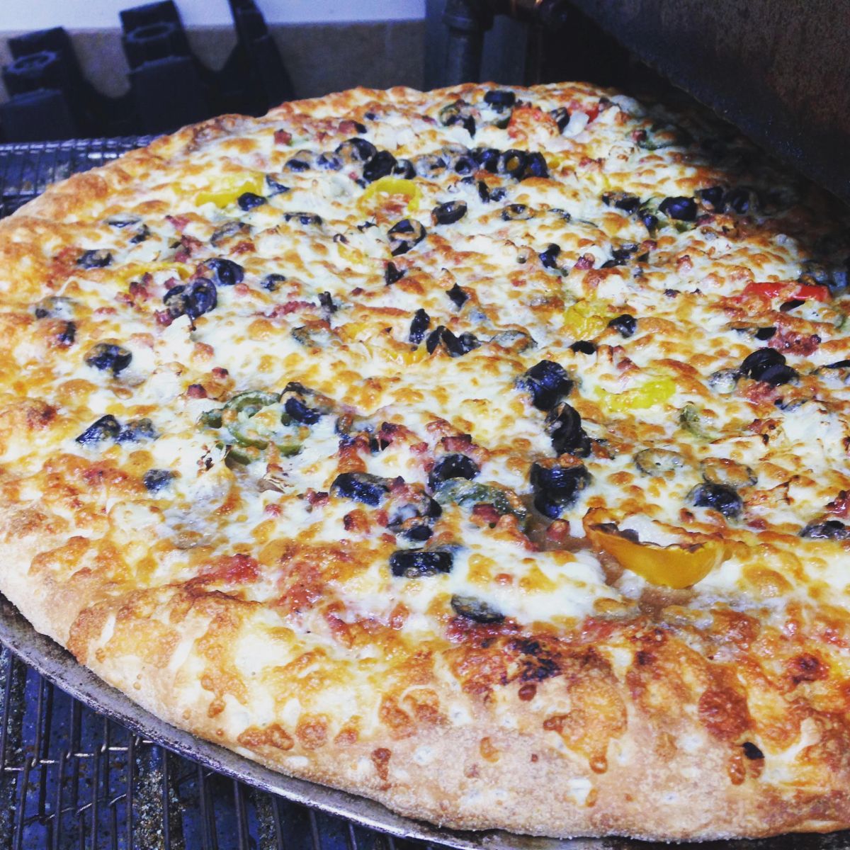An 18-inch Dillo's pizza straight off the oven rack